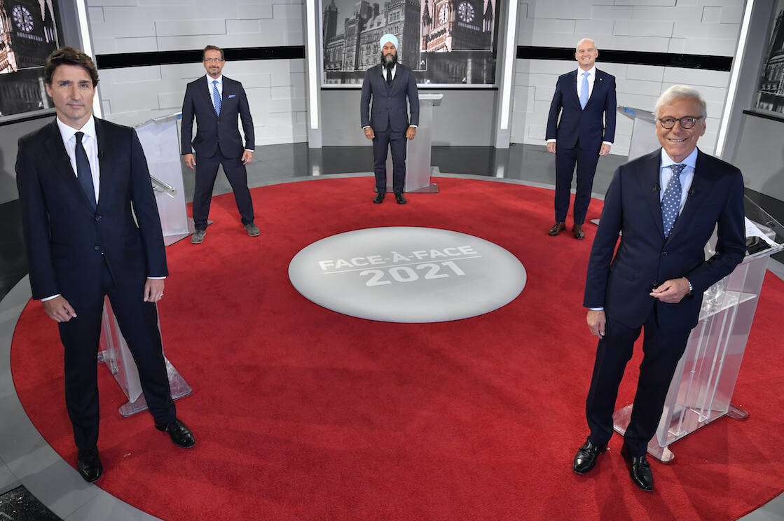Liberal Leader Justin Trudeau, left to right, Bloc Quebecois Leader Yves-Francois Blanchet, NDP Leader Jagmeet Singh, Conservative Leader Erin O’Toole and debate moderator Pierre Bruneau pose for a photo during the first French leaders’ debate on Thursday, September 2, 2021 in Montreal. THE CANADIAN PRESS/Martin Chevalier - POOL