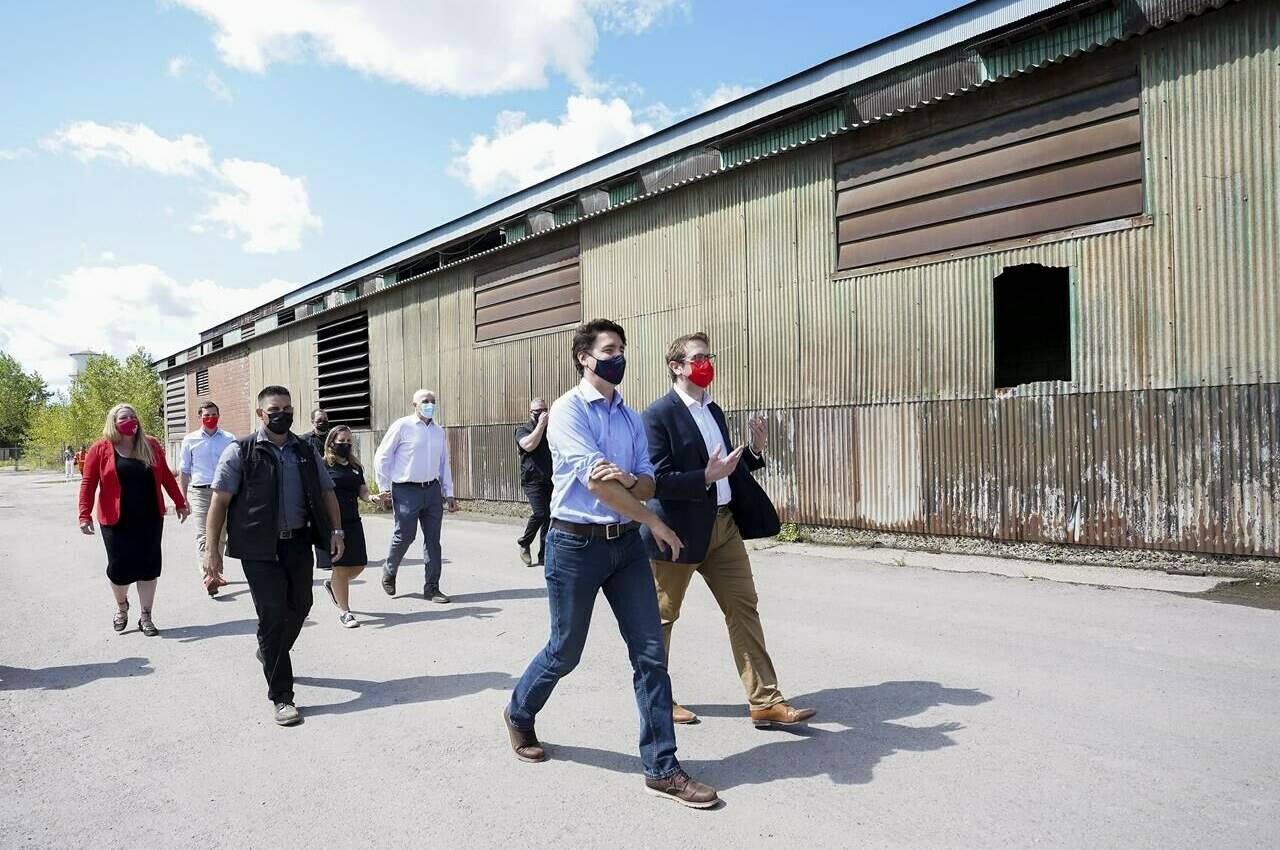 Liberal Leader Justin Trudeau, centre, along with Liberal candidates, makes a campaign stop at a steel plant during the Canadian federal election campaign in Welland, Ont., Monday, Sept. 6, 2021. THE CANADIAN PRESS/Nathan Denette