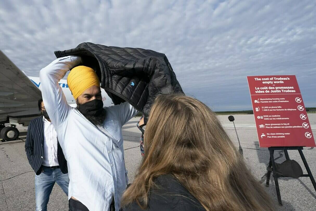 NDP leader Jagmeet Singh puts on his jacket following a morning announcement in Sioux Lookout, Ont., Monday, September 13, 2021. THE CANADIAN PRESS/Jonathan Hayward