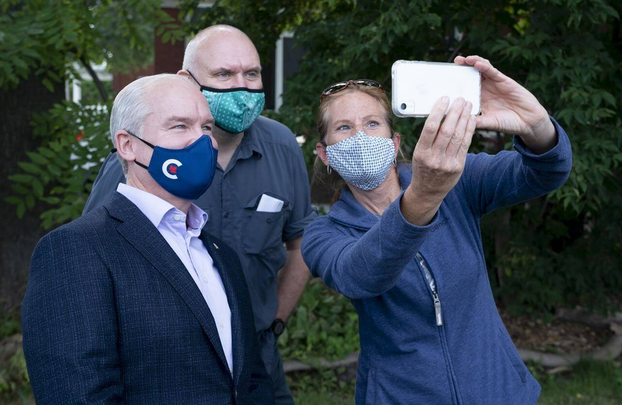 Conservative leader Erin O’Toole takes a photo with supporters during a campaign stop on Tuesday, September 14, 2021 in Russell, Ontario. THE CANADIAN PRESS/Adrian Wyld