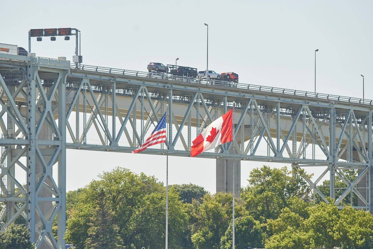 Trucks cross the Bluewater Bridge between Sarnia, Ont., and Port Huron, Mich., on August 15, 2021. THE CANADIAN PRESS/Geoff Robins