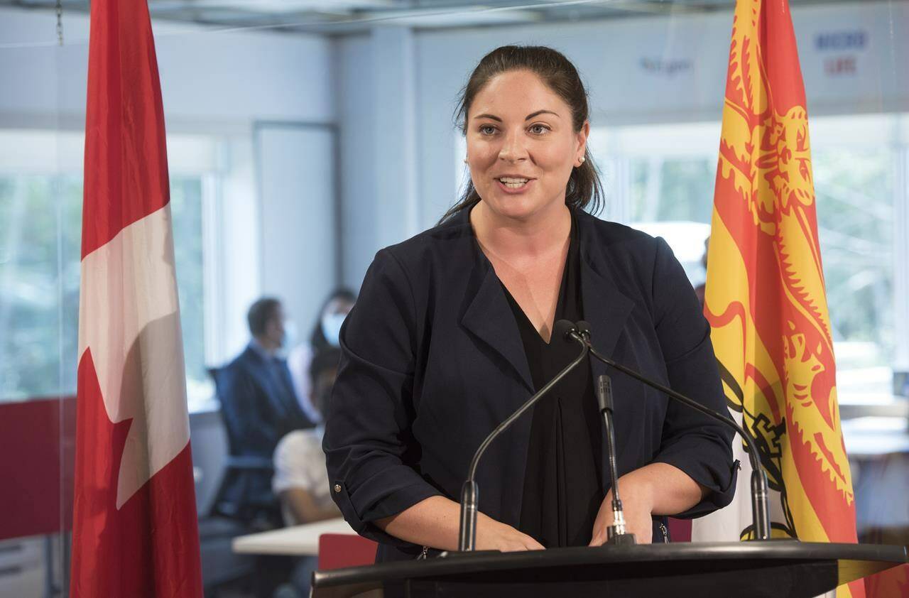 Jenica Atwin, Member of Parliament for Fredericton, speaks to the media during a funding announcement in Fredericton, N.B., on July 23, 2021. She was declared re-elected as a Liberal after Elections Canada finished counting special ballots. THE CANADIAN PRESS/Stephen MacGillivray