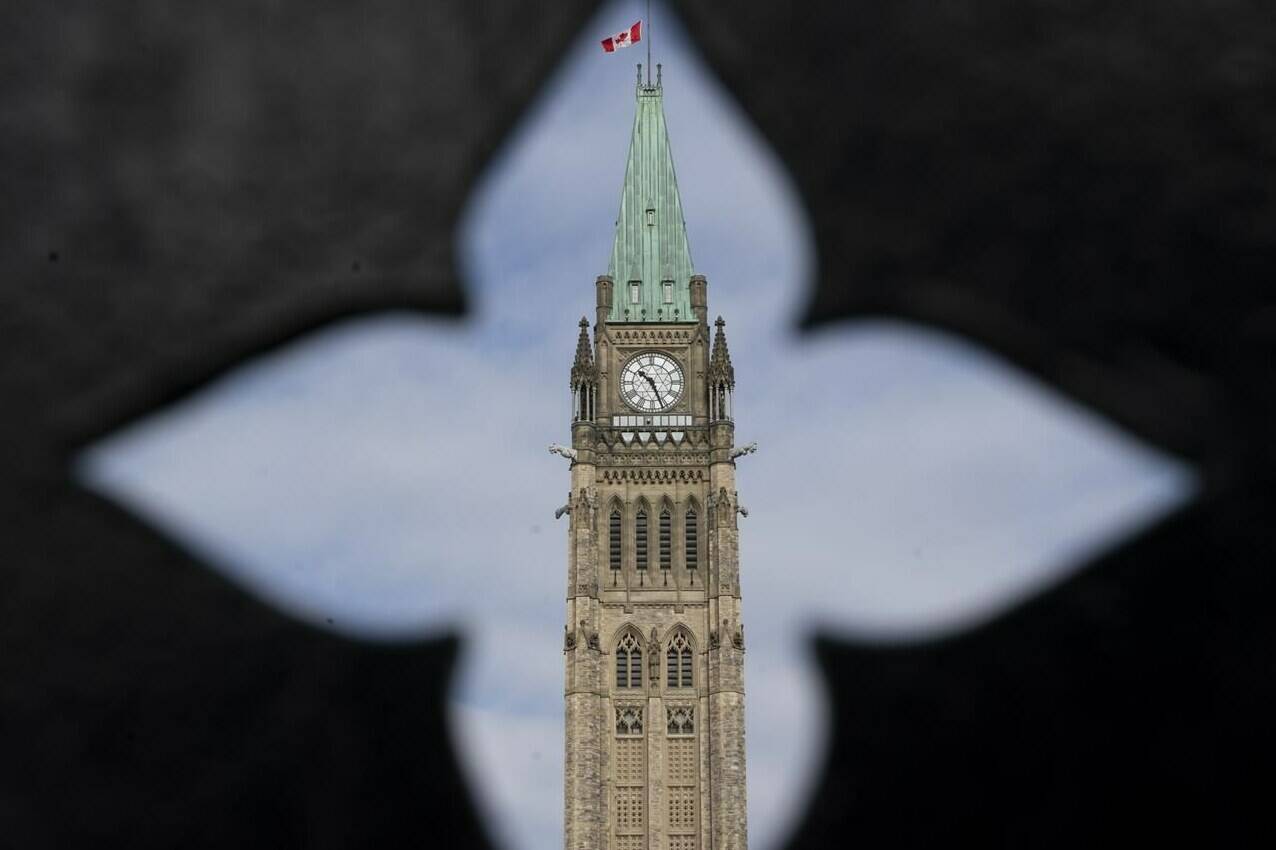 The Peace tower is seen as politicians begin returning to work in Ottawa, Tuesday, Oct. 5, 2021. The government’s draft policy to mandate vaccines for federal workers could close the door to allowing unvaccinated employees working from home, according to one union executive. THE CANADIAN PRESS/Adrian Wyld
