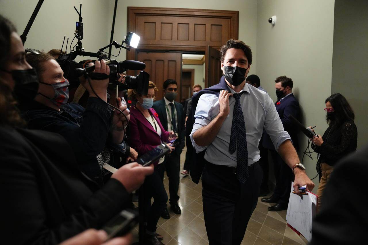 Prime Minister Justin Trudeau leaves a Liberal caucus meeting as members of the media look on in Ottawa on Monday, Nov. 8, 2021. THE CANADIAN PRESS/Sean Kilpatrick