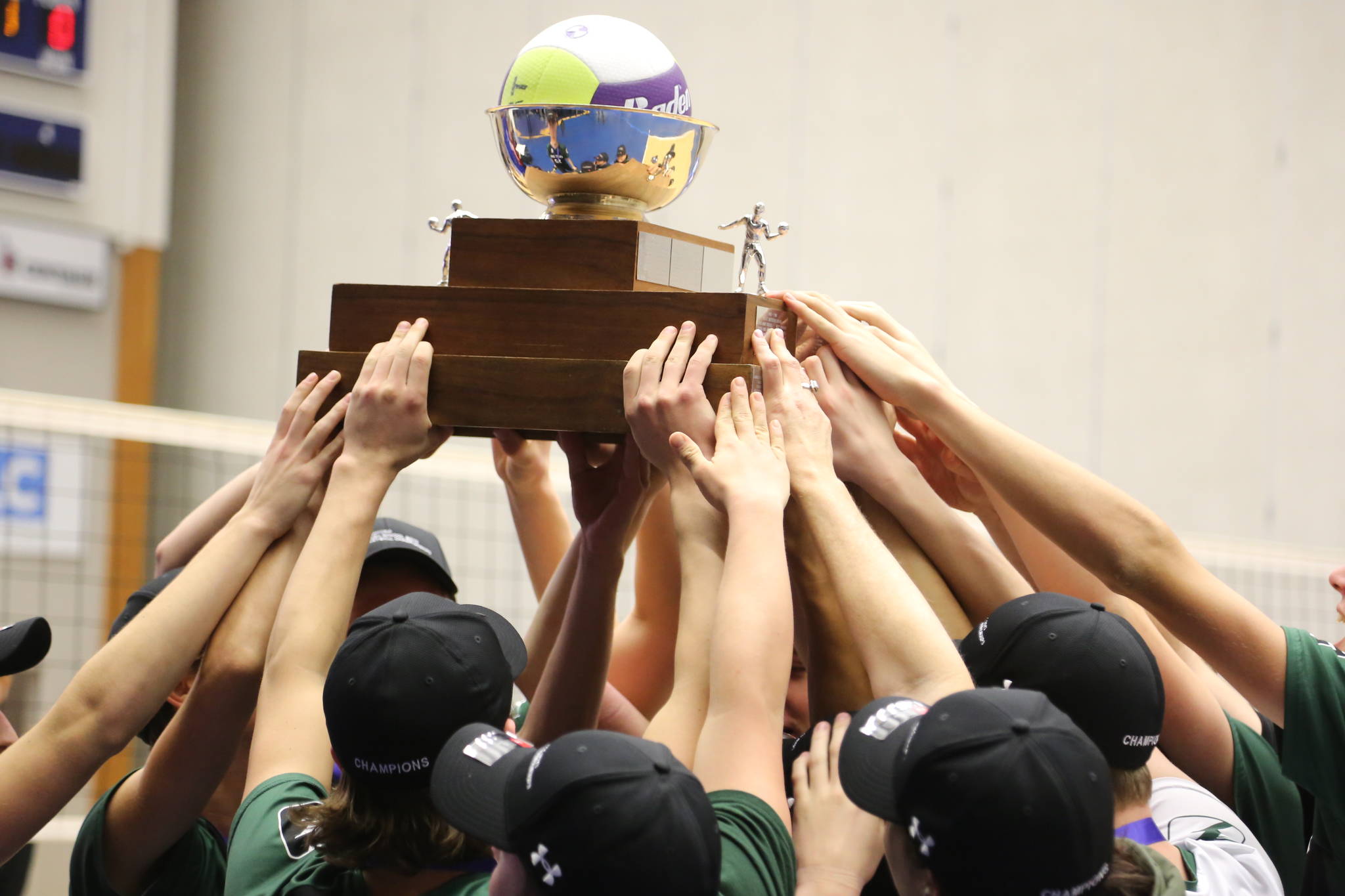 The Langley Christian Lightning hoist the championship trophy after defeating Abbotsford Christian at the Langley Events Centre on Saturday night. Greg Laychak Black Press