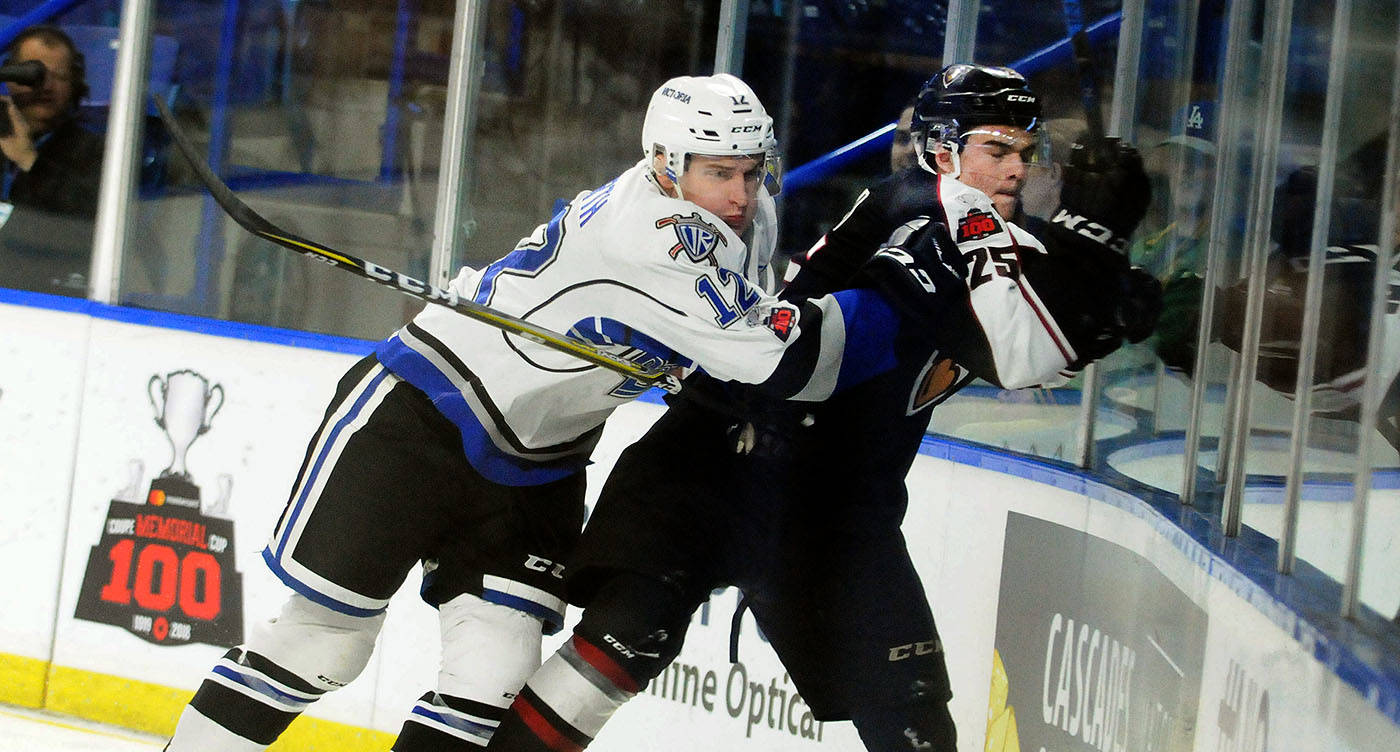 Victoria Royals forward Garth Spencer slammed into Vancouver Giants defenceman Kaleb Bulych early in Friday’s Western Hockey League game at the Langley Events Centre. Troy Landreville Black Press