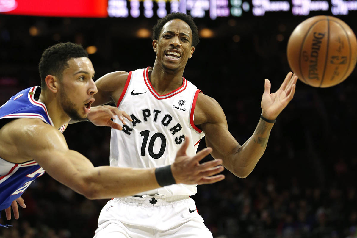 Philadelphia 76ers guard Ben Simmons (25) gets the ball away from Toronto Raptors guard DeMar DeRozan (10) during the first half on an NBA basketball game, Thursday, Dec. 21, 2017, in Philadelphia. (AP Photo/Laurence Kesterson)