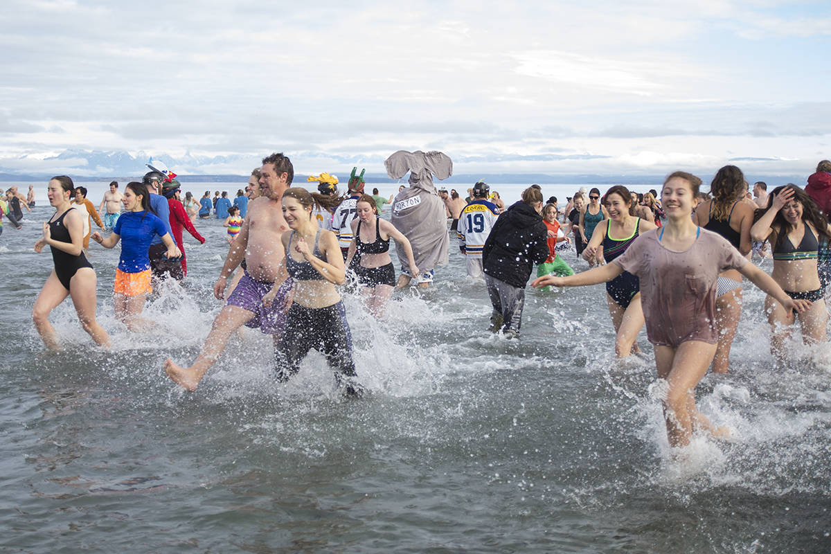 For many it is a mad rush in and out of the icy water at the annual Polar Plunge. Photo by Jocelyn Doll/Campbell River Mirror