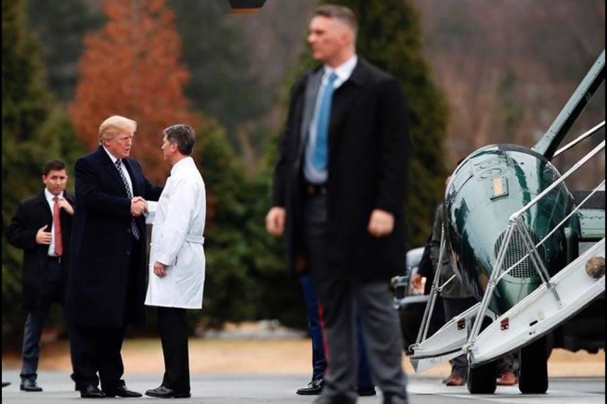 President Donald Trump shakes hands with White House physician Dr. Ronny Jackson as he boards Marine One as he leaves Walter Reed National Military Medical Center in Bethesda, Md., Friday after his first medical check-up as president. (Carolyn Kaster/AP Photo)