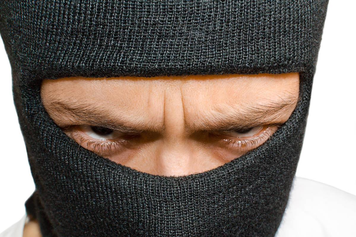 Stock image of Caucasian male donning a balaclava.