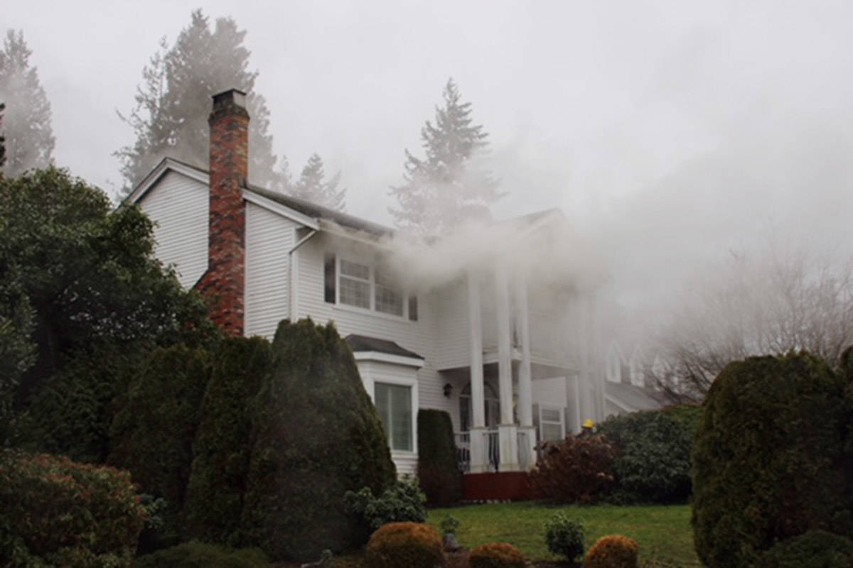 Surrey Fire Department, EMS and RCMP respond to house fire near the 28B Avenue and 174A Street intersection in South Surrey Thursday afternoon. (Shane MacKichan photos)