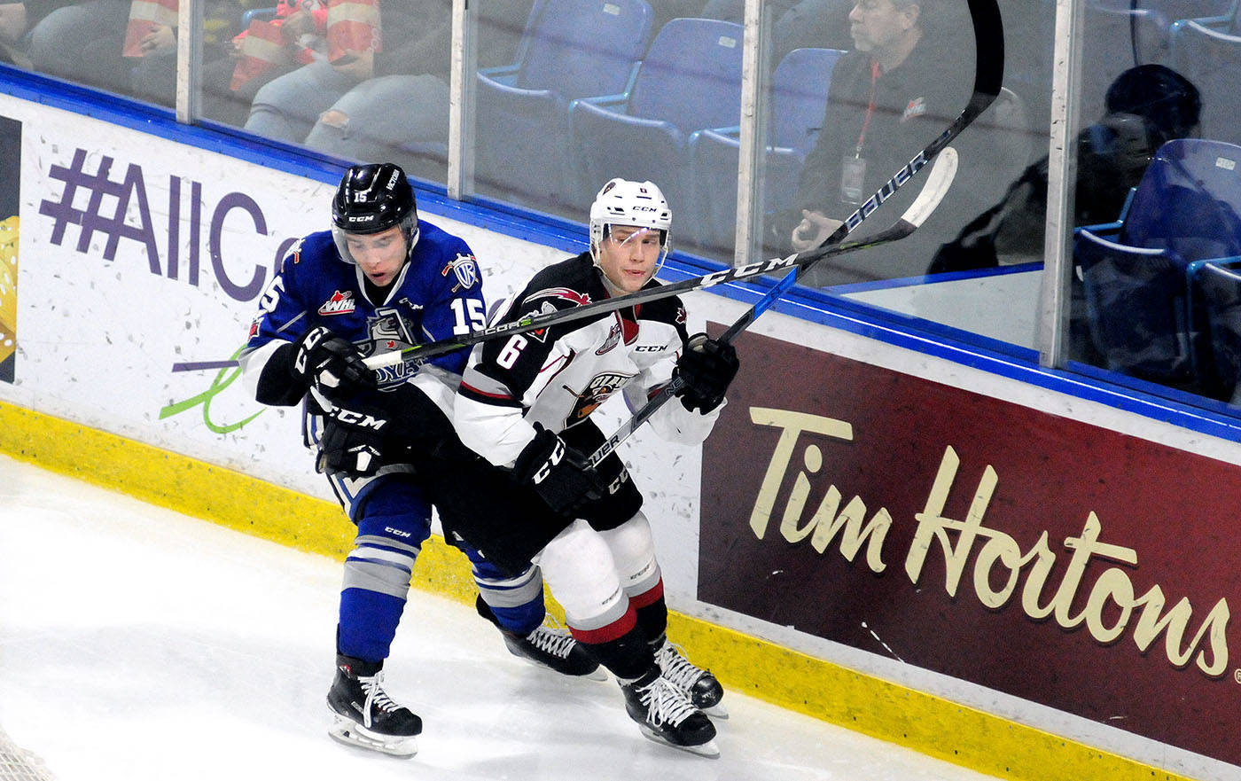 Victoria Royals forward Igor Martynov got his stick up on Vancouver Giants defenceman Dylan Plouffe in WHL action Saturday at the Langley Events Centre. Troy Landreville Black Press