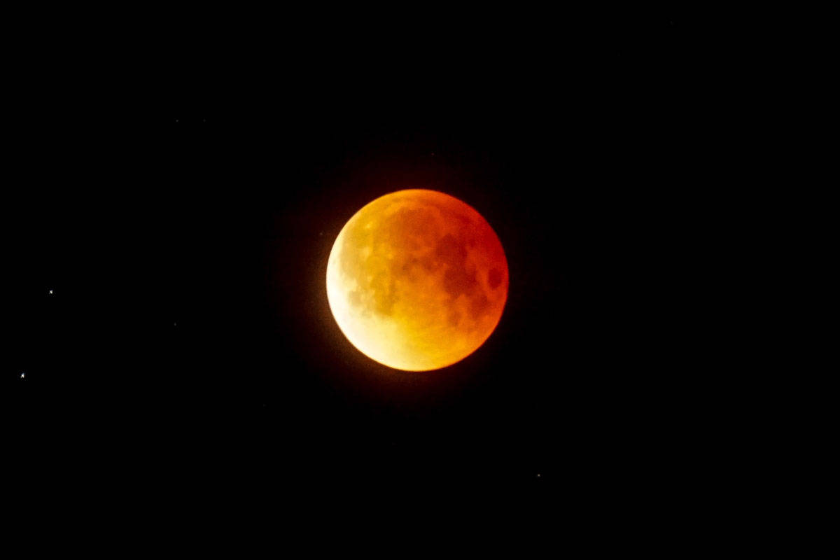 During the lunar eclipse at 5:55 a.m. on the North Coast, the moon turned red and orange, a.k.a. the “blood moon”. (Jonathon Bartlett photo)