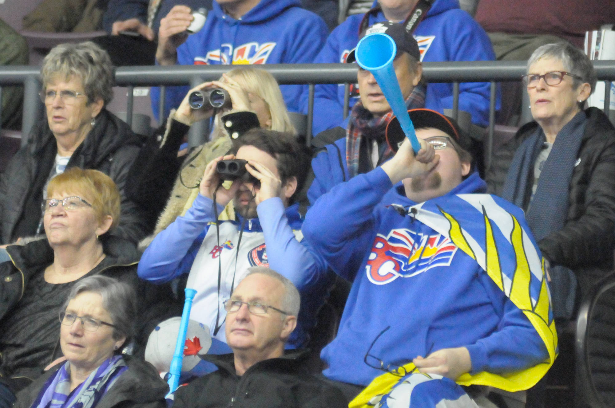 Mitko Mackenzi and Griffin Woodward dressed up in Team B.C. colours to cheer on their girlfriends, second Kalia Van Osch and Skip Kesa Van Osch.                                Steve Kidd/Western News