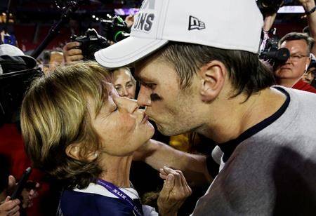 In this Feb. 1, 2015, file photo, New England Patriots quarterback Tom Brady kisses his mother, Galynn, after the NFL Super Bowl 49 football game against the Seattle Seahawks in Glendale, Ariz. (AP Photo/David J. Phillip, File)