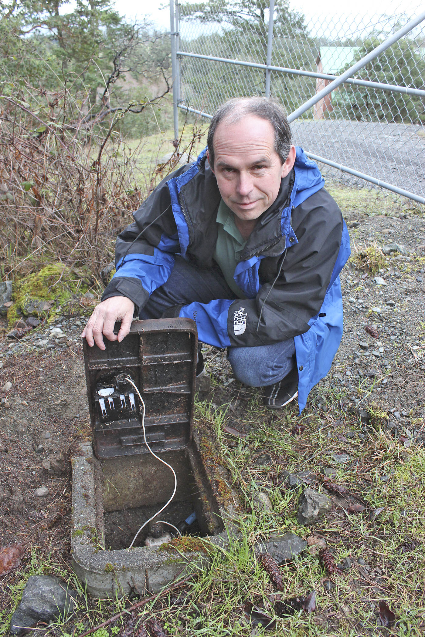 Peter Scott shows off the water meter on his property in Metchosin. Scott is on the hook for a $1,000 water bill to the Capital Regional District for a recent water leak. (Kendra Wong/News Gazette staff)