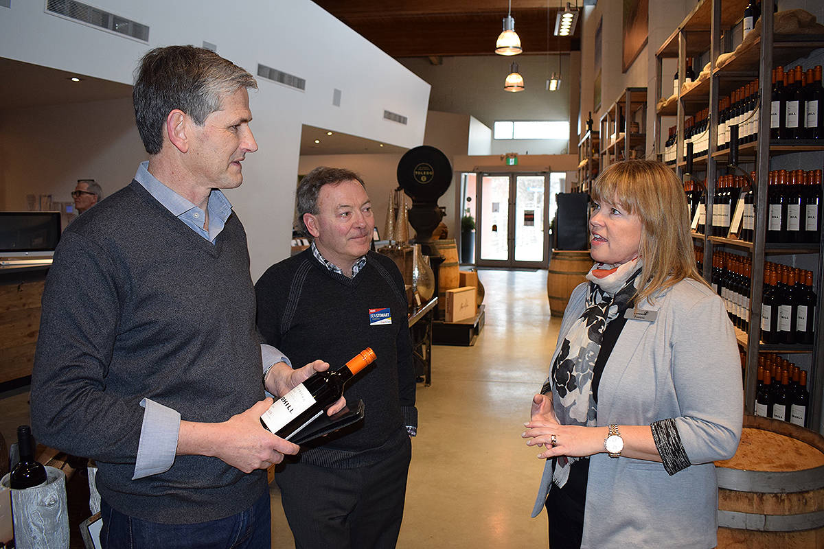 B.C. Liberal leader Andrew Wilkinson (left), seen here with Kelowna West Liberal candidate Ben Stewart, gets some wine advice from Sandhill Estate Winery manager Patricia Lesley Friday during a stop in Kelowna.—Image: Alistair Waters/Capital News