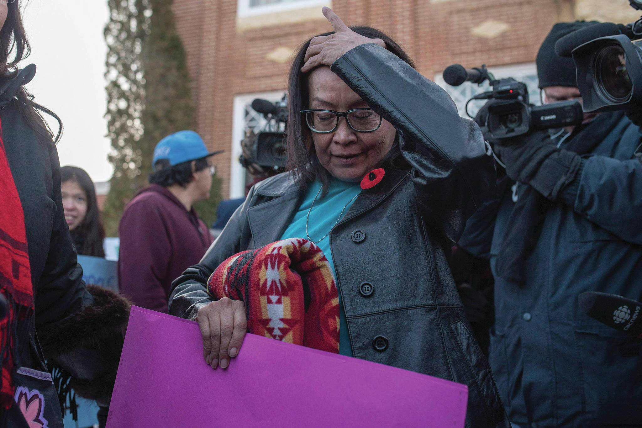 Debbie Baptiste, the mother of Colten Boushie, leaves during a lunch recess on the day of closing arguments in the trial of Gerald Stanley, the farmer accused of killing 22-year-old Indigenous man Colten Boushie, in Battleford, Sask. on Thursday, February 8, 2018. THE CANADIAN PRESS/Liam Richards