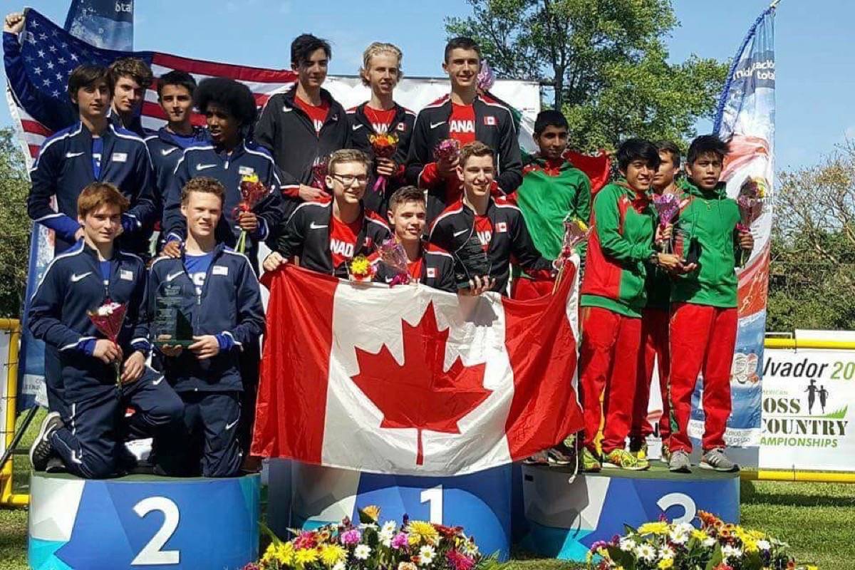 Tyler Dozzi, middle, and fellow Team Canada runners take the podium after collectively winning first in the Pan American championship last Saturday. The team won because it had the most high ranking runners than any other team, with athletes in second, third, fourth and seventh. In photo on the podium for Canada is Marcus Kemp (23rd), Thomas Nobbs (3rd), and Max Turek (7th) in back. In front is Brandon Bail (19th), Tyler Dozzi (2nd), and Andrew Alexander (4th). (Photo contributed)