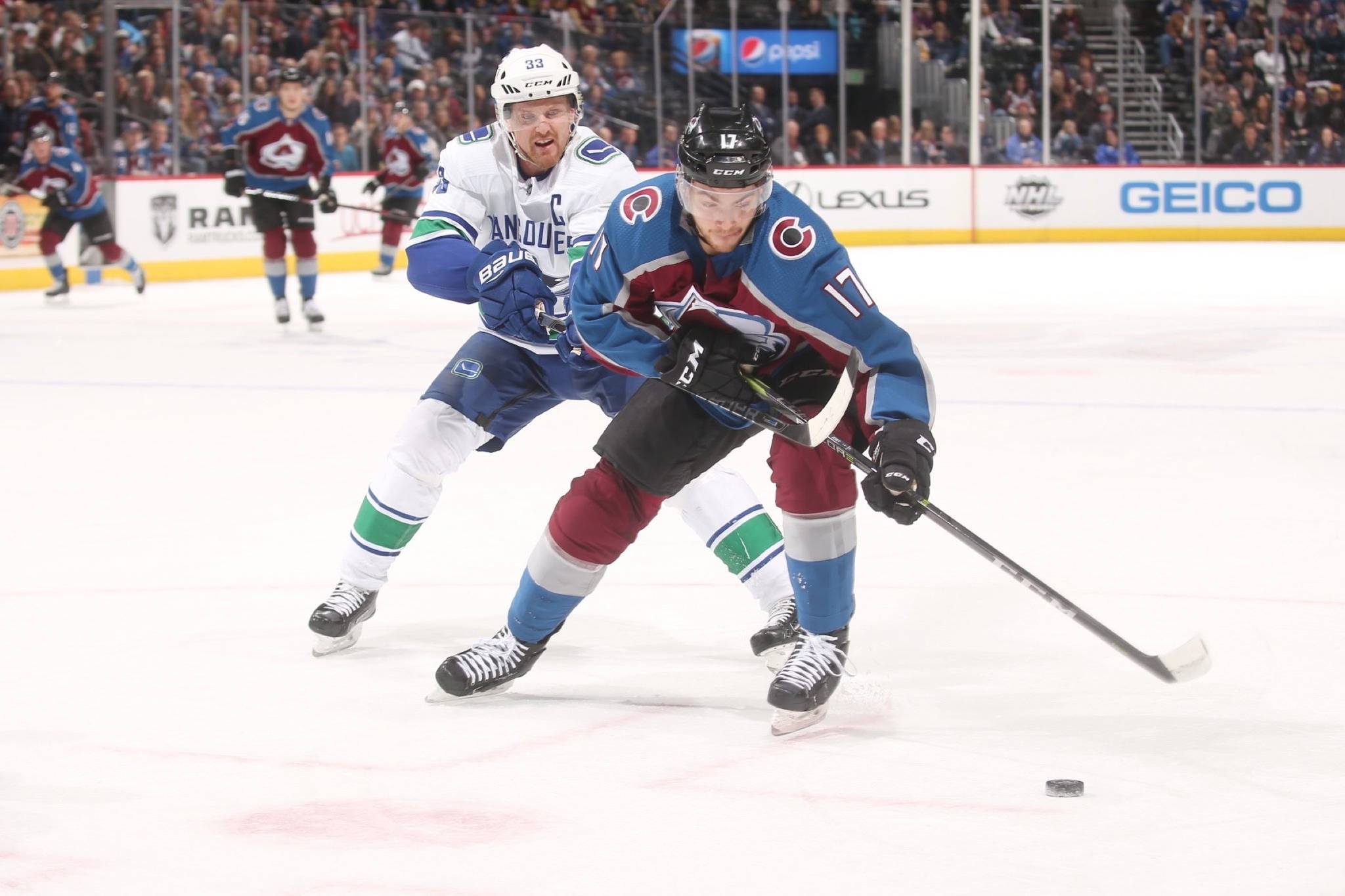 Canucks’ Henrik Sedin tries to strip Avs’ rookie, Tyson Jost of the puck, as Avs defeat Canucks 3-1 (via @Canucks/Twitter)