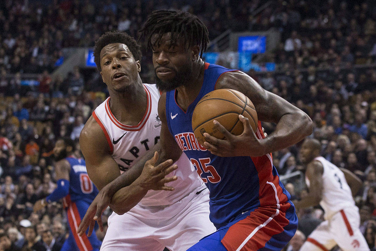 Detroit Pistons&rsquo; Reggie Bullock (right) is guarded by Toronto Raptors&rsquo; Kyle Lowry during first half NBA basketball action in Toronto on Monday, February 26, 2018. THE CANADIAN PRESS/Chris Young
