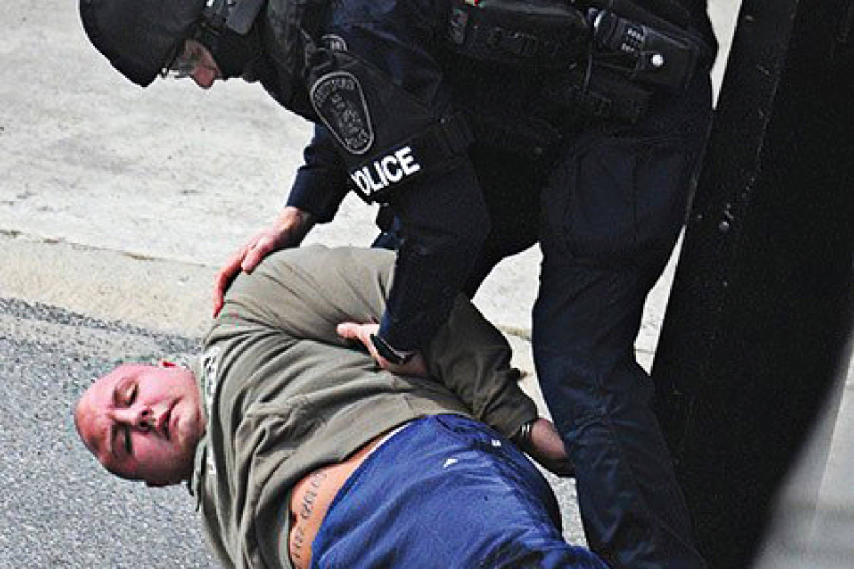 Police arrest Jamie Bacon. (Black Press photo).