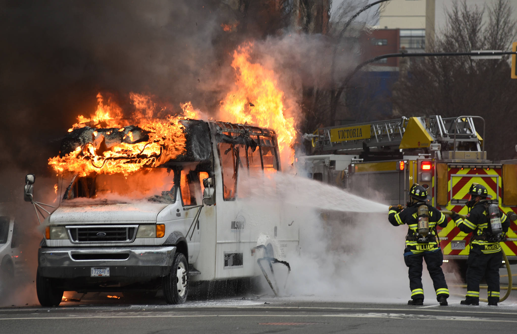 Firefighters put out a bus fire on Blanshard Street at Fort Street. Don Denton/Victoria News