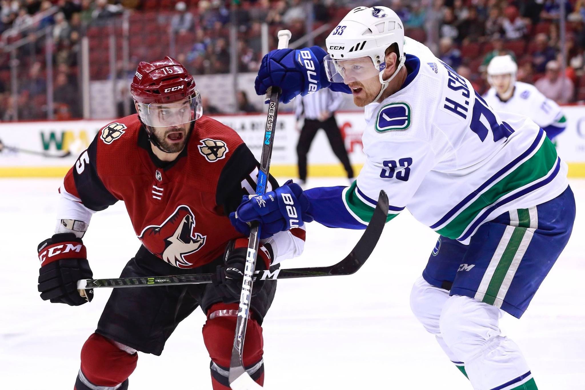 Canucks’ Henrik Sedin battles for the puck against ex-Canuck Brad Richardson as Vancouver falls to Arizona (via @Canucks/Twitter)