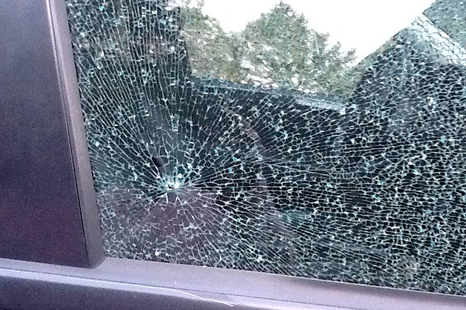 A picture submitted to the Chronicle shows damage on the passenger side window that was possibly caused by a BB gun, according to the motorist. (Submitted Photo)