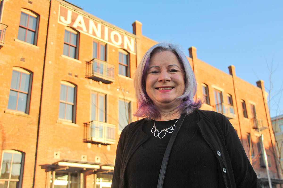 Debra Sheets stands in front of The Janion on Pandora Avenue, where she owns a short-term rental unit. News file photo