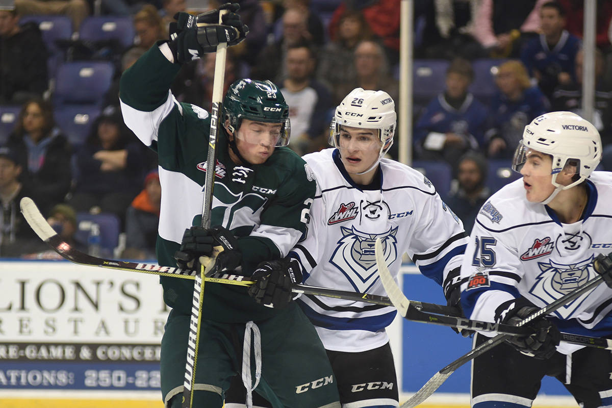 Victoria Royals’ Andrei Grishakov (centre in white) and Dino Kambeitz mix it up with Everett’s Jake Christiansen in Western Hockey League action. The Silvertips won both ends of the teams’ regular season-ending series, 8-1 Saturday in Victoria and 3-2 at home on Friday. Don Denton/Black Press