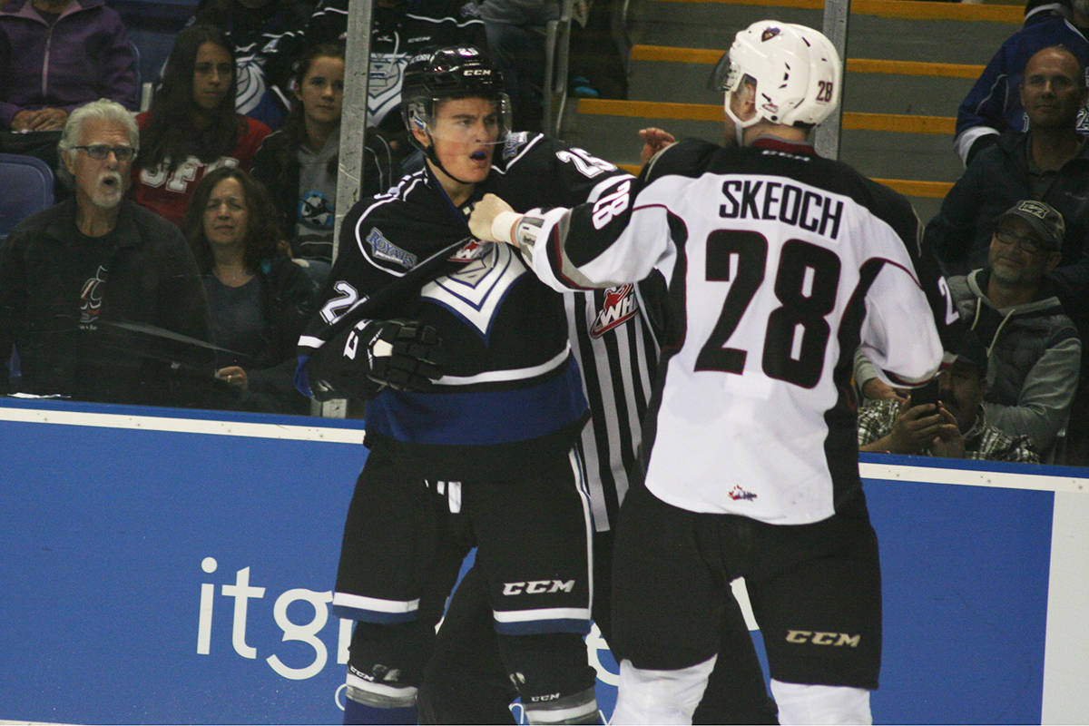 Victoria Royals forward Dino Kambeitz (left) and Vancouver defenceman Darian Skeoch go toe to toe in a Western Hockey League game earlier this season at Save-On-Foods Memorial Centre. The Royals and Giants play the first two games of their opening round playoff series here Friday and Saturday. Don Descoteau/Victoria News
