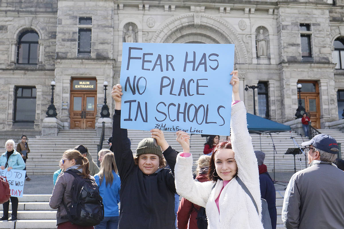 Students Nigel from Alberta and Devon from Victoria join the March for Our Lives protest on March 24. Anna James/VICTORIA NEWS