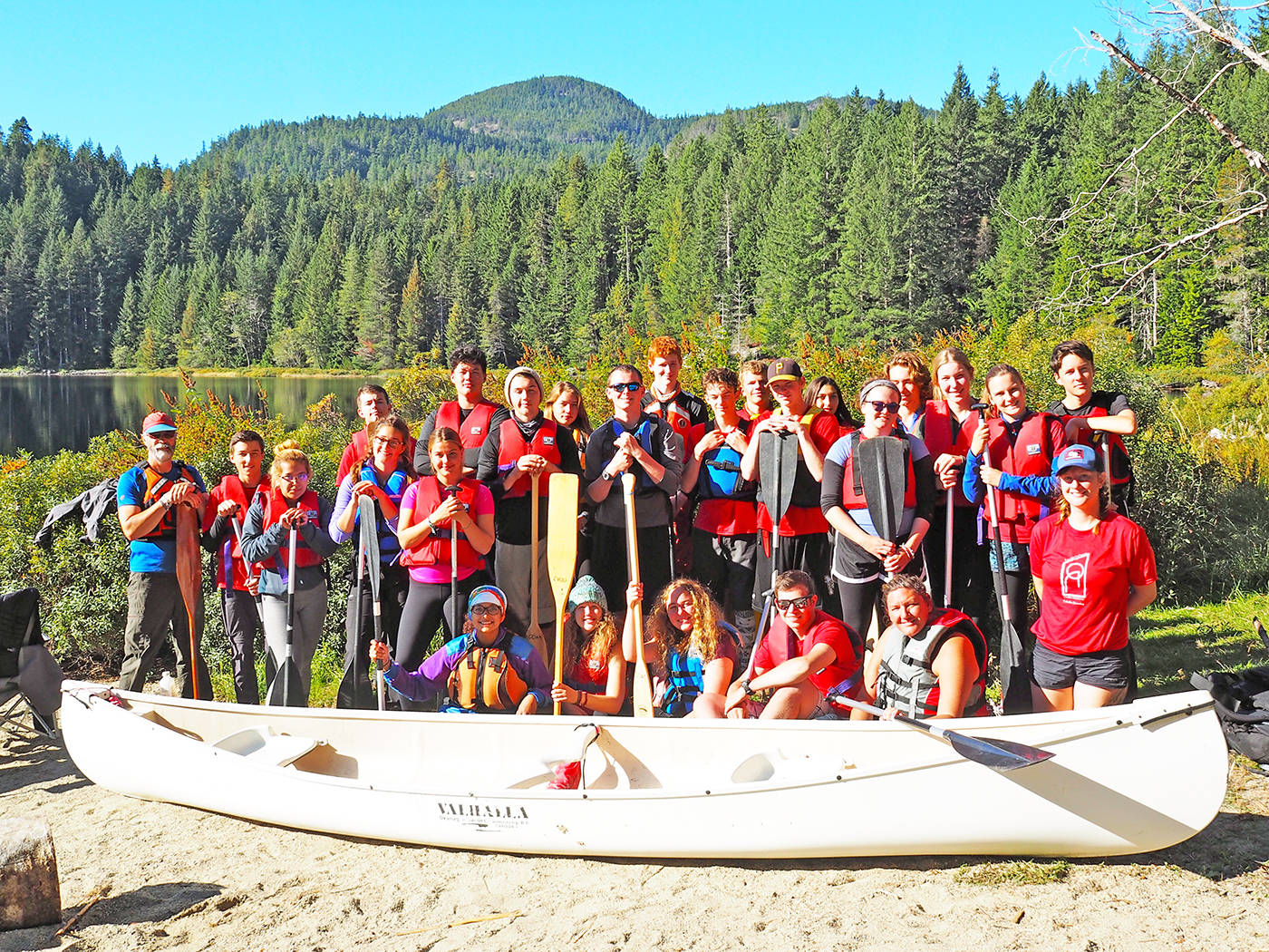 Timberline Secondary Outdoor Adventure students take a quick break for a celebratory photo during a recent paddling trip over on Quadra Island.