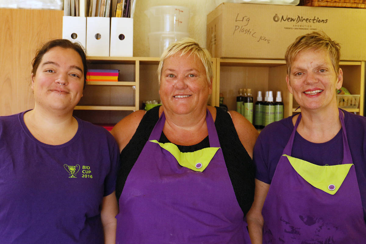 Amanda Velasco, left, Cheri Velasco and Lenore LeMay from Euphoria Potions and Edibles take a break from creating cannabis-infused products in their Esquimalt kitchen. They continue to sell the baked goods after their Great Canadian Canna Mall on Quadra Street was closed down, having been denied an application for rezoning. Anna James/VICTORIA NEWS