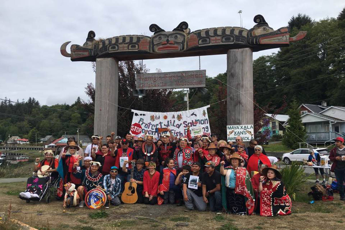 FACEBOOK PHOTO/Swanson Occupation Members and the ‘Namgis First Nation pose in front of a sign in Alert Bay in fall of 2017.