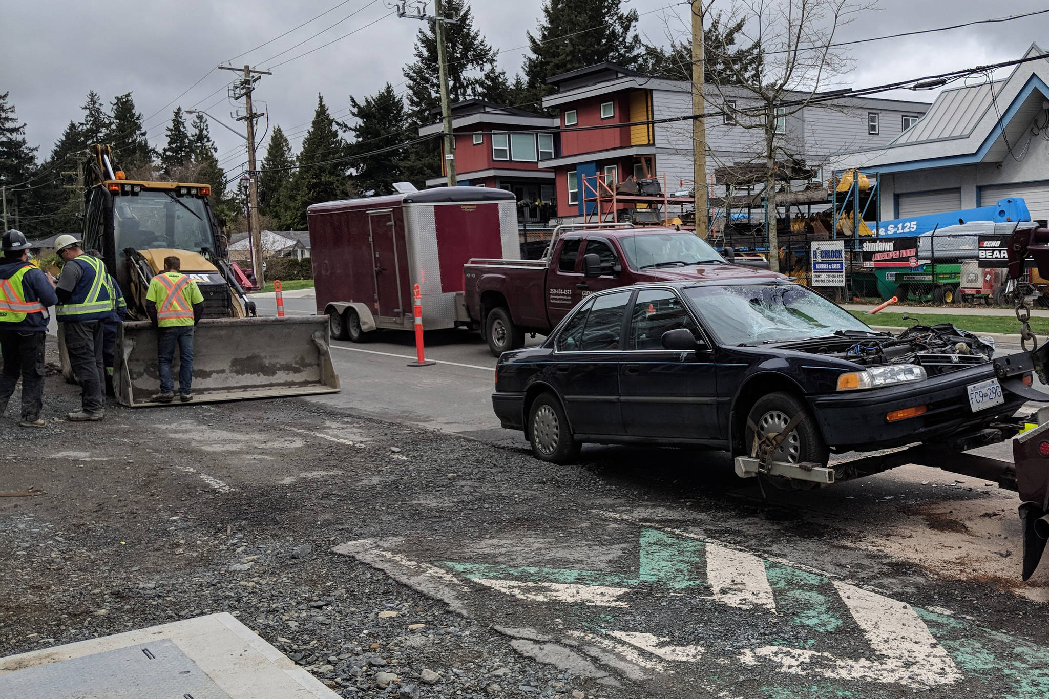 A collision between a backhoe and a vehicle occurred at Jacklin Road and Jenkins Avenue in Langford today.