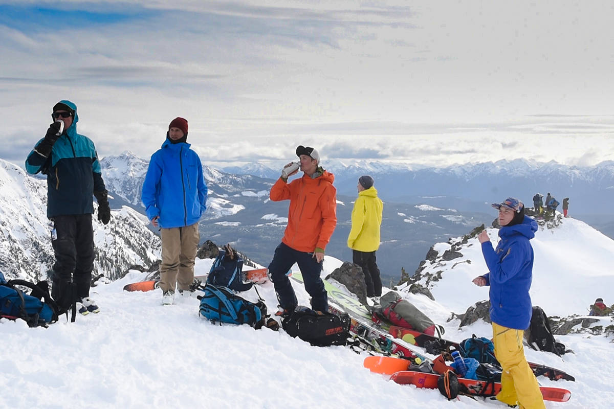 MOUNT CAIN PHOTO                                Skiers ontop of the mountain enjoy a break and taking the breathtaking views.