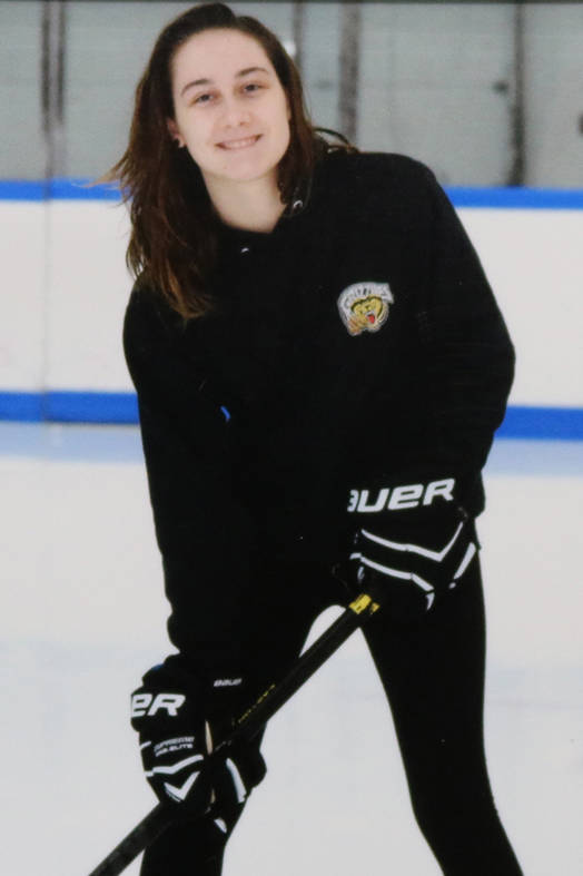 Tia Arseneault poses on the ice for her picture as a volunteer for the South Island Ravens hockey team. (Photo contributed)