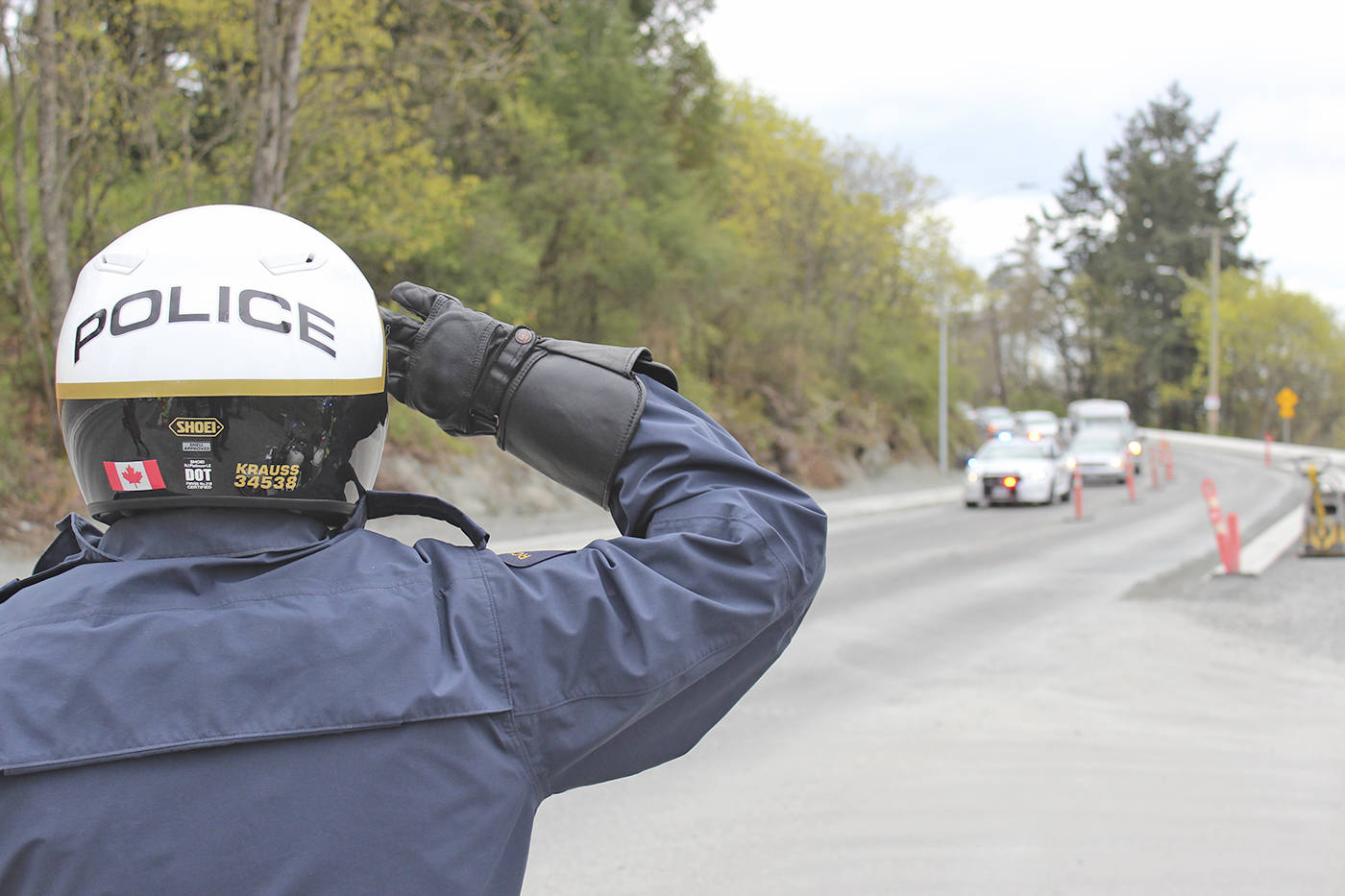 Members of the West Shore RCMP and the View Royal Fire Department lined the intersection of Thomas and Admirals roads to pay their final respects to Esquimalt Nation Chief Andy Thomas, who passed away suddenly on Saturday.                                (Ragnar Haagen/Black Press)