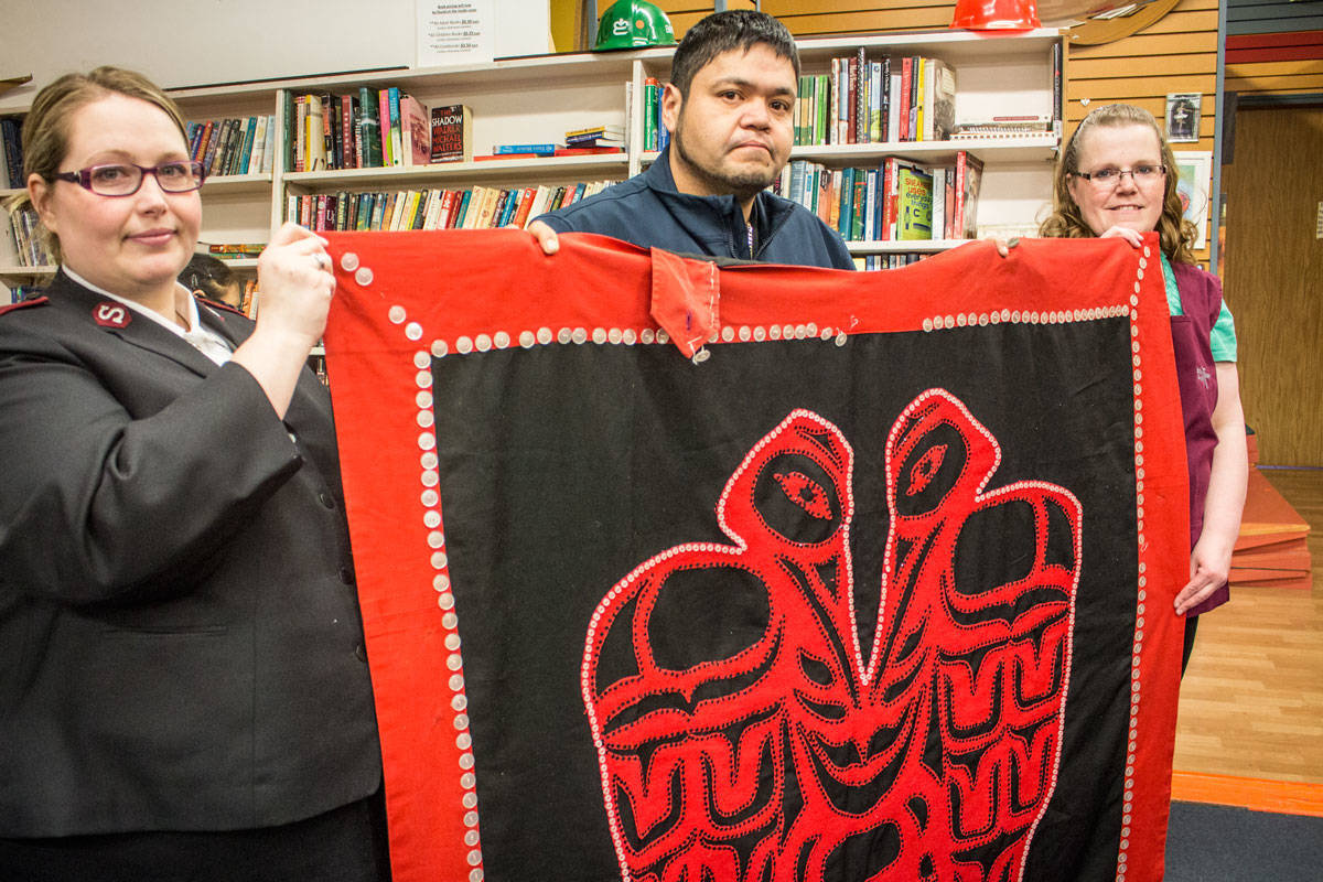 A heartfelt reunion, as Lt. Sabrina Silvey and Roma Dawe of the Prince Rupert Salvation Army give Oliver Stewart his mother’s long-lost, handmade regalia. (Keili Bartlett / The Northern View)
