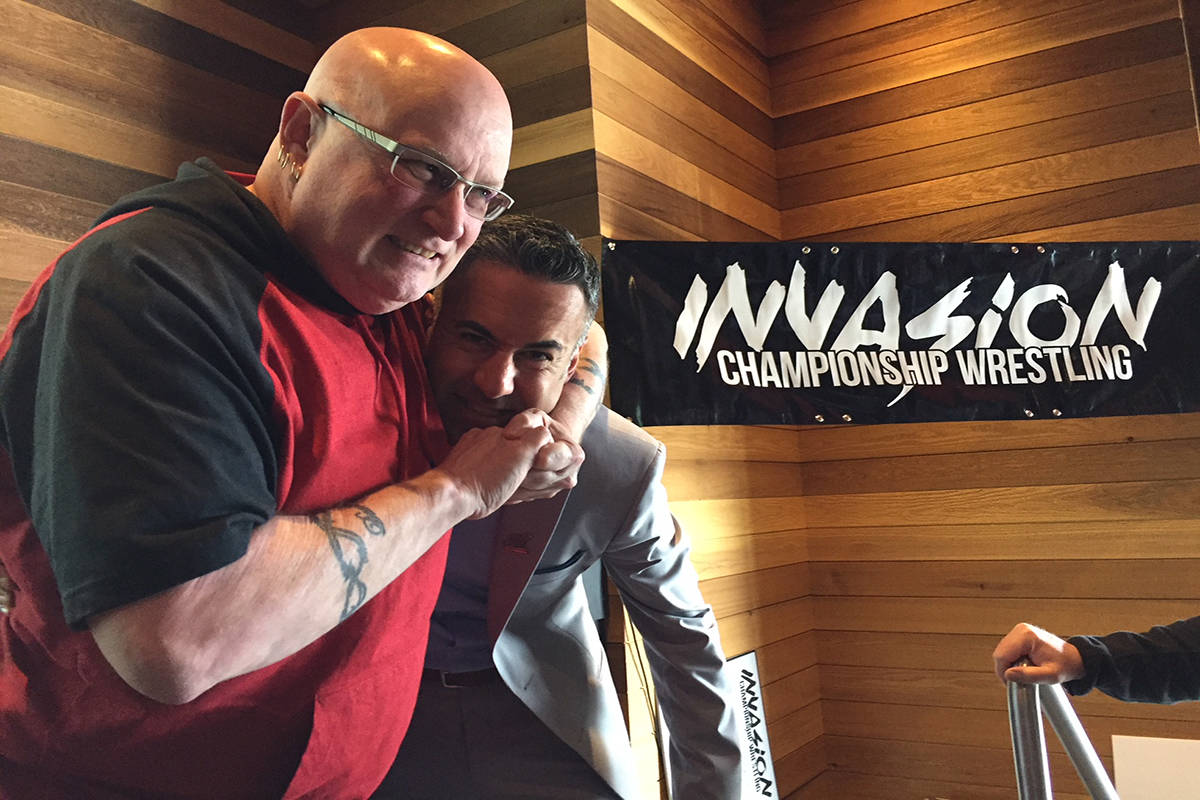 Kelowna Mayor Colin Basran finds himself in a headlock courtesy of Invasion Championship Wrestling matchmaker Tim Flowers. Photo: Barry Gerding/Black Press