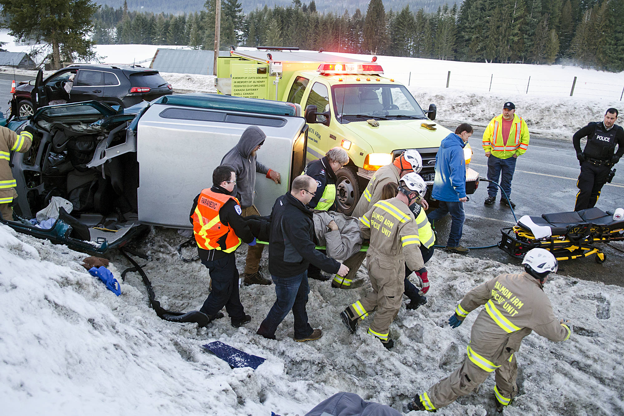 Lachlan Labere/Salmon Arm Observer file                                Emergency responders carry a man to an awaiting ambulance after being extricated from his pickup truck, one of two vehicles involved in a collision along Highway 97B in Salmon Arm.