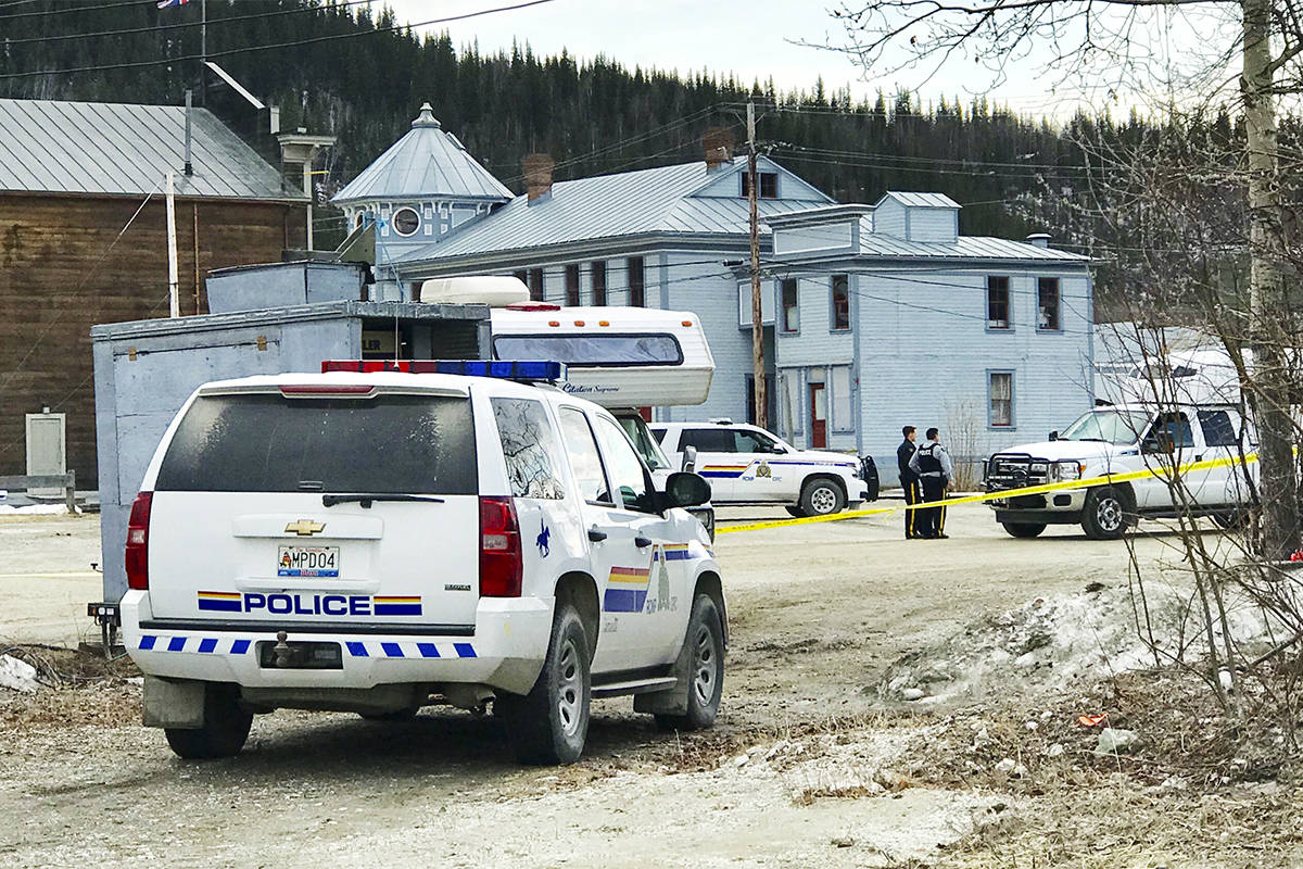 Police investigate the site of a suspicious death in Dawson City on April 30. RCMP the man’s death is being treated as a homicide. (Cathie Archbould/Yukon News file)