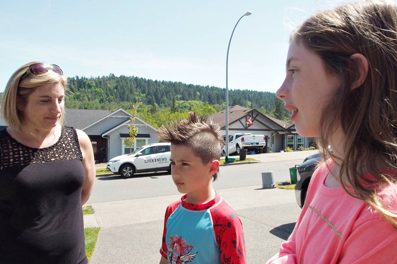 Cathy Torney, her son Jayden and daughter Natasha recount the trauma of being attacked by two pitbulls that seriously injured their friend and a neighbour who stepped in to help them. (CHRIS BUSH/The News Bulletin)