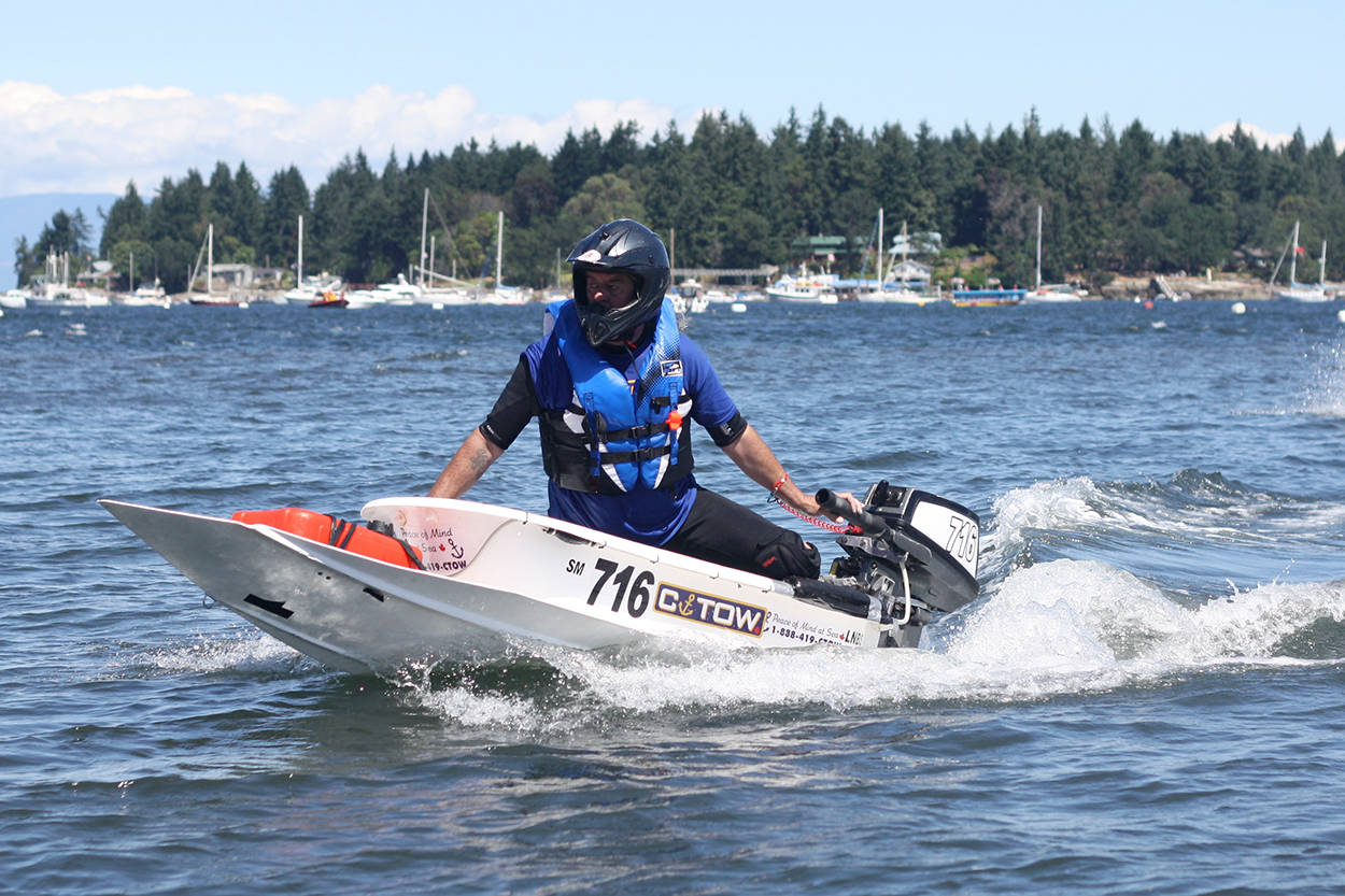 Nanaimo bathtub racer Kurt Henderson reaches the beach at Maffeo Sutton Park at the end of the Great International World Championship Bathtub Race last summer. NEWS BULLETIN file photo