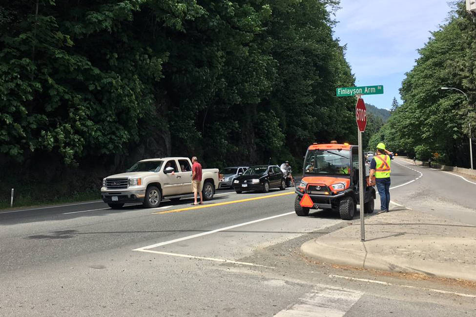 An ATV was used for queue management and to distribute water to motorists waiting during the Malahat closure Thursday. (Photo by @TranBC/Twitter)