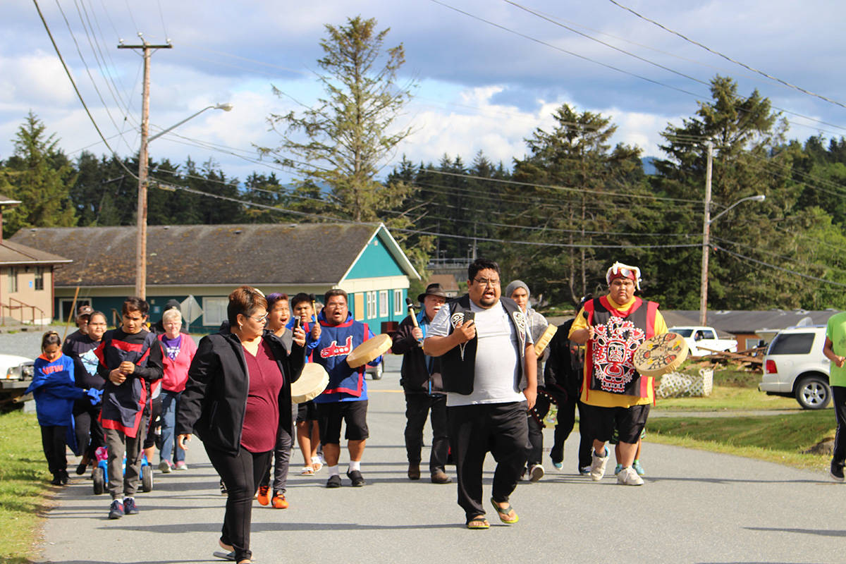 HANNA PETERSEN PHOTO                                Participants march through Tsulquate Reserve chanting “We don’t need drugs or alcohol.”