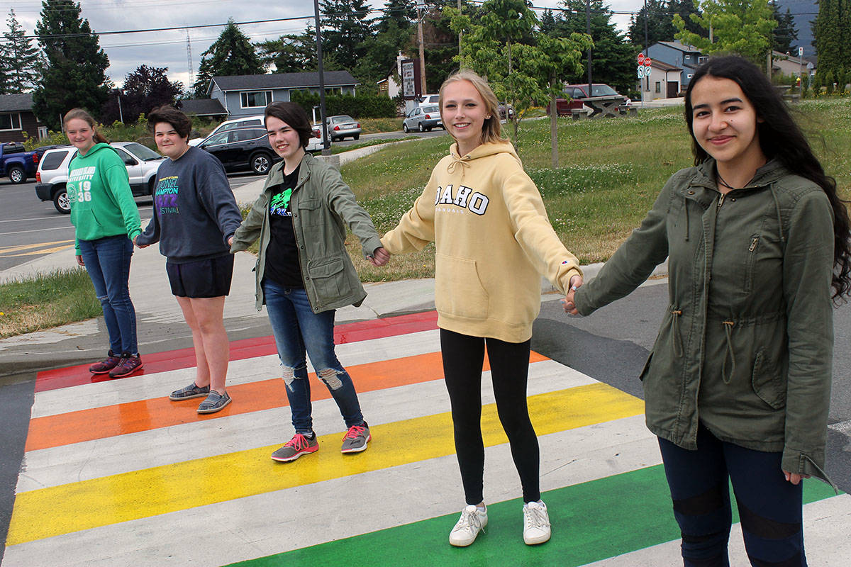 Wellington Secondary’s Queer Strait Alliance members Clara Jaeger, left, Hannah Hitchen, Bethany Morley, Alexis Barudin and Onuku Larochelle stand on a new rainbow crosswalk, the first of its kind in the school district. TAMARA CUNNINGHAM/News Bulletin