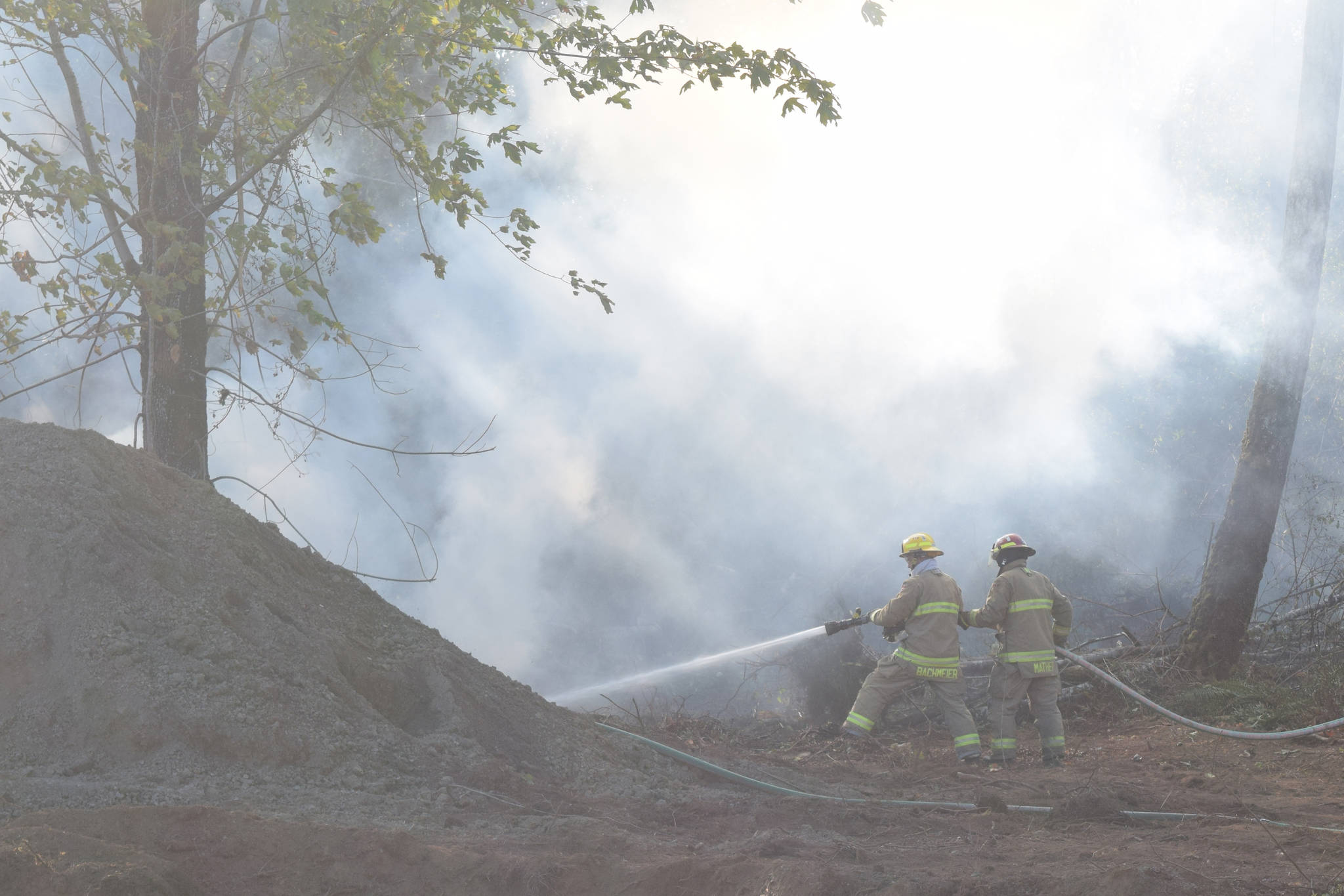 Beaver Creek firefighters put out a fire on Mersey Rd in Beaver Creek. ELENA RARDON PHOTO